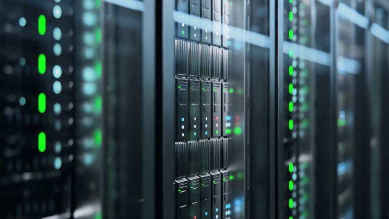 Servers with green lights in a data center.